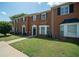 Brick townhomes with bay windows and well-manicured lawns at 1507 Paces Ferry North Se, Smyrna, GA 30080