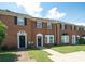 A row of well-maintained brick townhomes with front lawns at 1507 Paces Ferry North Se, Smyrna, GA 30080