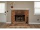 Traditional brick fireplace with white mantle in a cozy living space at 1507 Paces Ferry North Se, Smyrna, GA 30080