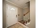Entryway with tile flooring, stairs, and a front door with glass detail at 1507 Paces Ferry North Se, Smyrna, GA 30080