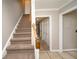 Foyer showcasing the staircase, a coat closet, and neutral paint at 1507 Paces Ferry North Se, Smyrna, GA 30080