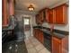 Well-equipped kitchen with granite counters, stainless steel sink and appliances, and wood cabinets at 1507 Paces Ferry North Se, Smyrna, GA 30080