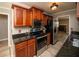Modern kitchen with granite countertops, stainless steel appliances, and cherry wood cabinetry at 1507 Paces Ferry North Se, Smyrna, GA 30080