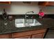 Close-up on the stainless steel kitchen sink with granite countertops at 1507 Paces Ferry North Se, Smyrna, GA 30080