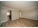 Spacious living room with an opening to the kitchen, modern flooring, and neutral walls at 1507 Paces Ferry North Se, Smyrna, GA 30080