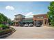 Exterior shot of a commercial building with a covered patio and 'Moes' signage at 1507 Paces Ferry North Se, Smyrna, GA 30080