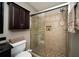 Bathroom featuring a shower with glass doors and decorative tile at 1507 Paces Ferry North Se, Smyrna, GA 30080