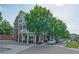 A streetscape with tree-lined sidewalks and outdoor seating at restaurants at 1507 Paces Ferry North Se, Smyrna, GA 30080