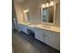 Bright bathroom features double sinks, vanity space, and white cabinets at 3730 Reserve Overlook (Lot 8) Way, Cumming, GA 30041