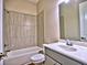Clean bathroom featuring a tub with tiled walls and a large mirror over the sink at 3730 Reserve Overlook (Lot 8) Way, Cumming, GA 30041