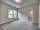 Bedroom showcases plush carpet, natural light from window, and walk-in closet, creating a serene space at 3730 Reserve Overlook (Lot 8) Way, Cumming, GA 30041
