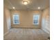 Spacious bedroom with plush carpet boasts two windows at 3730 Reserve Overlook (Lot 8) Way, Cumming, GA 30041