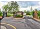 Elegant gated community entrance with stone pillars and manicured landscaping at 3730 Reserve Overlook (Lot 8) Way, Cumming, GA 30041