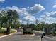 Entrance to Chattahoochee Reserve features a stone sign, manicured landscaping, and secure gates at 3730 Reserve Overlook (Lot 8) Way, Cumming, GA 30041