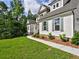 Beautiful two-story home featuring manicured lawn and walkway leading to the entrance at 3730 Reserve Overlook (Lot 8) Way, Cumming, GA 30041