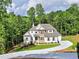 Beautiful two-story home with a well-manicured lawn and a welcoming driveway at 3730 Reserve Overlook (Lot 8) Way, Cumming, GA 30041