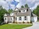 Beautiful two-story home featuring stone accents, neutral siding, and a well-maintained lawn at 3730 Reserve Overlook (Lot 8) Way, Cumming, GA 30041