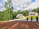 Picturesque view of two homes on a lush lot, highlighting the property's spacious setting and community feel at 3730 Reserve Overlook (Lot 8) Way, Cumming, GA 30041