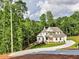 Stunning home with manicured lawn, showcasing the property's curb appeal and well-maintained landscaping at 3730 Reserve Overlook (Lot 8) Way, Cumming, GA 30041