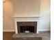 A brick fireplace with a classic white mantle creates a warm and inviting focal point at 3730 Reserve Overlook (Lot 8) Way, Cumming, GA 30041