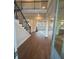 Grand two-story foyer with hardwood floors, iron stair railings, and an open view into the living spaces at 3730 Reserve Overlook (Lot 8) Way, Cumming, GA 30041