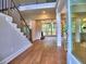 Grand foyer featuring hardwood floors, staircase with iron railings, and open view to the living spaces at 3730 Reserve Overlook (Lot 8) Way, Cumming, GA 30041
