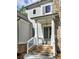 Inviting entrance with stone steps, classic columns, and a light fixture that enhances its curb appeal at 3730 Reserve Overlook (Lot 8) Way, Cumming, GA 30041
