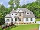 Beautiful two-story home with a stone and siding facade, landscaped front yard, and inviting entrance at 3730 Reserve Overlook (Lot 8) Way, Cumming, GA 30041