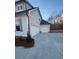 Attached and detached garages with a concrete driveway at 3730 Reserve Overlook (Lot 8) Way, Cumming, GA 30041