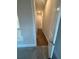 Hallway with hardwood floors and neutral walls leading to a bedroom or bathroom at 3730 Reserve Overlook (Lot 8) Way, Cumming, GA 30041