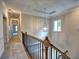 Upstairs hallway with carpet, overhead lighting, and an ornate hanging light fixture at 3730 Reserve Overlook (Lot 8) Way, Cumming, GA 30041