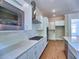 A modern kitchen featuring sleek countertops, stainless steel appliances, and white cabinets at 3730 Reserve Overlook (Lot 8) Way, Cumming, GA 30041
