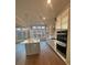 Well-designed kitchen with a central island, sleek appliances, and plenty of counter space at 3730 Reserve Overlook (Lot 8) Way, Cumming, GA 30041