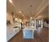 Bright, open kitchen with an island, granite countertops and stainless steel appliances at 3730 Reserve Overlook (Lot 8) Way, Cumming, GA 30041