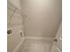 Bright laundry room features tiled floors, utility connections, and storage shelving at 3730 Reserve Overlook (Lot 8) Way, Cumming, GA 30041