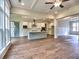 Open floor plan with hardwood floors, kitchen island, stainless appliances, and lots of natural light at 3730 Reserve Overlook (Lot 8) Way, Cumming, GA 30041