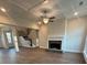 Spacious living room with a cozy fireplace and stairs leading to the upper level at 3730 Reserve Overlook (Lot 8) Way, Cumming, GA 30041
