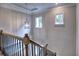 View of the second story staircase featuring a decorative light fixture at 3730 Reserve Overlook (Lot 8) Way, Cumming, GA 30041