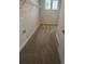 Carpeted walk-in closet features wire racks and a window at 3730 Reserve Overlook (Lot 8) Way, Cumming, GA 30041