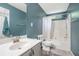 Bathroom with updated vanity, tub-shower combo, and blue walls, is designed for relaxation at 734 Kilkenny Cir, Lithonia, GA 30058