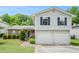 Charming two-story home with gray siding, blue shutters, and a well-manicured lawn at 734 Kilkenny Cir, Lithonia, GA 30058