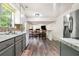A contemporary kitchen features granite countertops, stainless steel appliances, and wood floors at 734 Kilkenny Cir, Lithonia, GA 30058
