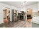 Eat-in kitchen with stainless steel appliances, tile backsplash, and gray cabinets at 734 Kilkenny Cir, Lithonia, GA 30058