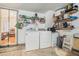 Functional laundry room featuring a washer, dryer, and ample storage space at 734 Kilkenny Cir, Lithonia, GA 30058
