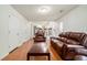 An open floor plan displays a living room with seating that transitions into a dining area and kitchen at 734 Kilkenny Cir, Lithonia, GA 30058