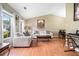 Bright and airy living room with vaulted ceilings, wood floors, and lots of natural light at 734 Kilkenny Cir, Lithonia, GA 30058