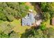 Aerial view of the property showcasing the home, deck, and surrounding landscape at 836 Palmetto Tyrone Rd, Sharpsburg, GA 30277