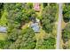 Aerial view of the property showcasing the home, deck, and surrounding landscape at 836 Palmetto Tyrone Rd, Sharpsburg, GA 30277
