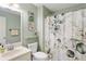 Fresh bathroom with stylish shower curtain, modern fixtures, and coordinated accessories at 836 Palmetto Tyrone Rd, Sharpsburg, GA 30277