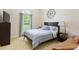 Cozy bedroom with a large window and neutral decor provides a peaceful retreat at 836 Palmetto Tyrone Rd, Sharpsburg, GA 30277